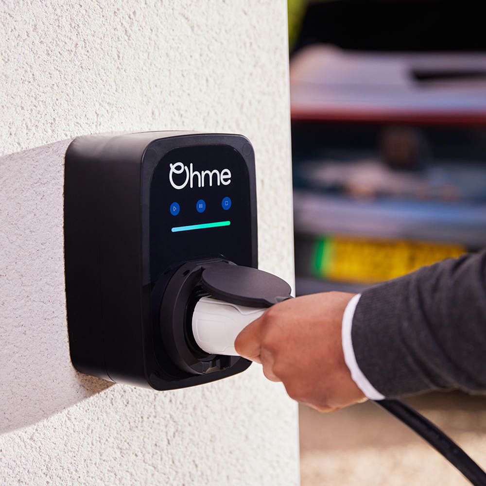Ohme EV charger plugged in at home.